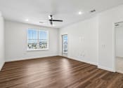 Thumbnail 71 of 124 - Empty bedroom with wood flooring and balcony access at Velara Luxury Apartments, Florida, 32081