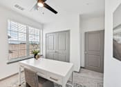 Thumbnail 39 of 43 - A room with a white desk and a ceiling fan. at The Hadley - North Port, FL Apartments, North Port