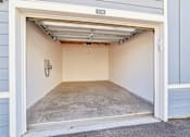 Thumbnail 84 of 124 - Private garage with concrete floor and overhead door at Velara Luxury Apartments, Ponte Vedra Beach, FL