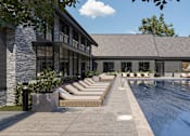 Thumbnail 11 of 11 - A pool area with sun loungers and a building in the background at The Pullman Luxury Apartment Homes, Atlanta, GA 30349
