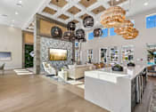 Thumbnail 104 of 124 - Clubhouse lounge with vaulted ceiling and statement chandeliers at Velara Luxury Apartments, Ponte Vedra Beach, FL 32081