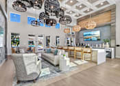Thumbnail 23 of 124 - Clubhouse lounge with coffered ceiling and pendant lights at Velara Luxury Apartments, Ponte Vedra Beach, FL