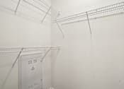 Thumbnail 104 of 105 - Closet With Shelving at The Pullman Luxury Apartments, Atlanta, GA, 30349
