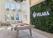 Thumbnail 95 of 124 - Recreation room with pool table and living wall at Velara Luxury Apartments, Ponte Vedra Beach, FL
