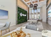 Thumbnail 101 of 124 - Clubhouse entrance with living wall and modern decor at Velara Luxury Apartments, Ponte Vedra Beach, Florida