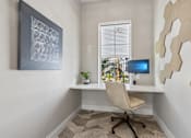 Thumbnail 114 of 124 - Compact home office with builtin desk and chair at Velara Luxury Apartments, Florida