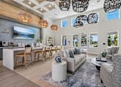 Thumbnail 97 of 124 - Clubhouse lounge with bar seating and pendant lighting at Velara Luxury Apartments, Florida, 32081