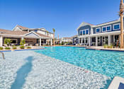 Thumbnail 17 of 124 - Resort style swimming pool with clubhouse and cabana at Velara Luxury Apartments, Ponte Vedra Beach, 32081