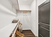 Thumbnail 31 of 124 - Walkin closet with hanging rods and shelf storage at Velara Luxury Apartments, Florida, 32081