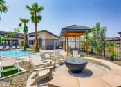 Thumbnail 34 of 68 - our apartments have a pool and lounge area with chairs and a fire pit  at Grandstone at Sunrise, Peoria, 85383