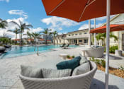 Thumbnail 10 of 32 - Poolside Lounge Area at The Boardwalk at Tradition, Port St Lucie, FL