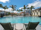 Thumbnail 1 of 32 - Pool With Relaxing Chairs at The Boardwalk at Tradition, Port St Lucie, FL, 34987