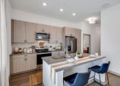 Thumbnail 2 of 32 - kitchen island and designer finishes at the boardwalk at tradition near stuart, florida