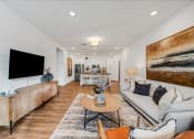 Thumbnail 22 of 45 - a living room with a couch and a tv at The BLVD at Wilson Crossings, Wyoming, 49418