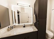 Thumbnail 7 of 18 - A bathroom with a white sink and a mirror.