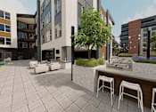 Thumbnail 9 of 45 - Modern outdoor seating area at The Union Flats at Fishers District, Fishers, 46037