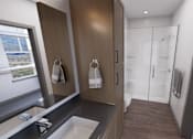 Thumbnail 6 of 21 - A modern bathroom with a sink, mirror, and wooden cabinets at Refinery at Pointe17 Apartments, Phoenix, AZ