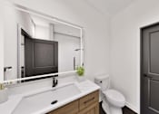 Thumbnail 16 of 32 - A bathroom with a white sink and a mirror above it.