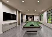 Thumbnail 31 of 32 - A room with a pool table and a television.