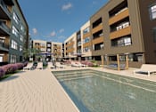 Thumbnail 19 of 35 - A swimming pool is surrounded by apartment buildings and landscaping.
