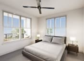 Thumbnail 7 of 35 - A bedroom with a large bed and a ceiling fan.