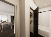 Thumbnail 11 of 35 - A black door is open to a bathroom with a white tub.