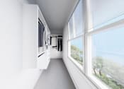 Thumbnail 29 of 35 - A long white hallway with a window on the right side.