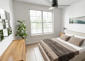 Thumbnail 4 of 20 - A bedroom with a bed, a ceiling fan, and a window with blinds.