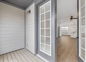 Thumbnail 22 of 58 - the view of a hallway from a home with white walls and doors at Meridian at CityPlace, Minnesota, 55125