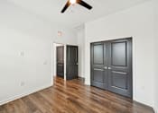 Thumbnail 28 of 43 - A room with a ceiling fan and two doors at The Hadley - North Port, FL Apartments, North Port 34287