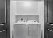 Thumbnail 34 of 124 - Laundry closet with side by side washer and dryer at Velara Luxury Apartments, Florida, 32081