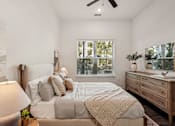 Thumbnail 27 of 57 - A bedroom with a bed, nightstand, and window at The Stadler Luxury Apartments, Bradenton, 34210