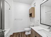Thumbnail 37 of 124 - Modern bathroom with wood vanity and subway tile shower at Velara Luxury Apartments, Ponte Vedra Beach, FL 32081