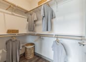 Thumbnail 13 of 31 - a walk in closet with white walls and wood flooring  at Prism at Diamond Ridge, Moon Township