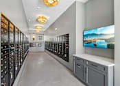 Thumbnail 38 of 124 - Mail room with lockable mailboxes and decorative lighting at Velara Luxury Apartments, Ponte Vedra Beach, Florida