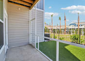 Thumbnail 42 of 124 - Private balcony with metal railing and palm tree views at Velara Luxury Apartments, Florida, 32081