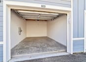 Thumbnail 41 of 124 - Single car garage with concrete floor and storage at Velara Luxury Apartments, Ponte Vedra Beach, Florida