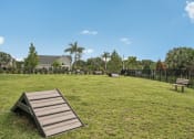 Thumbnail 47 of 58 - a park with benches in the grass at Palm Grove in Ellenton, FL 34222
