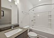 Thumbnail 64 of 68 - A white bathroom with a toilet, sink, and bathtub. at The Sophia, Venice, FL