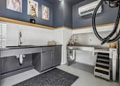 Thumbnail 14 of 24 - A modern bathroom with a sink, mirror, and a shower.