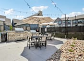 Thumbnail 25 of 39 - Pool deck patio furniture with umbrellas.