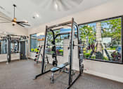 Thumbnail 29 of 68 - A well-equipped home gym with a view of the outdoors. at The Sophia, Venice, FL