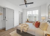 Thumbnail 33 of 58 - a bedroom with a large bed and a ceiling fan at Meridian at CityPlace, Woodbury, MN 55125