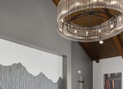Thumbnail 25 of 46 - a pool table in a living room with a chandelier at Alta25, Monument, 80132