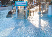 Thumbnail 120 of 124 - Community splash pad with water features and slides at Velara Luxury Apartments, Ponte Vedra Beach