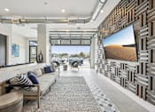 Thumbnail 34 of 59 - a living room with a couch and a television at The Quarry Luxury Apartment Homes, Fort Collins, CO