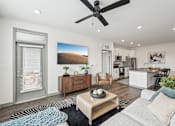 Thumbnail 11 of 59 - a living room with a ceiling fan at The Quarry Luxury Apartment Homes, Fort Collins, CO