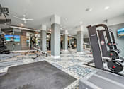 Thumbnail 49 of 59 - a gym with weights and other exercise equipment in a house at The Quarry Luxury Apartment Homes, Colorado, 80526