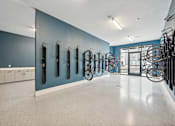Thumbnail 52 of 59 - a large room with bikes hanging on a blue wall at The Quarry Luxury Apartment Homes, Fort Collins