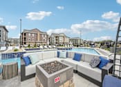 Thumbnail 45 of 59 - outdoor seating area with pool at The Quarry Apartments at The Quarry Luxury Apartment Homes, Fort Collins, 80526